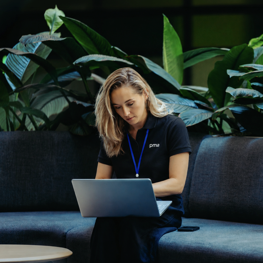 PMA technical specialist working on a laptop